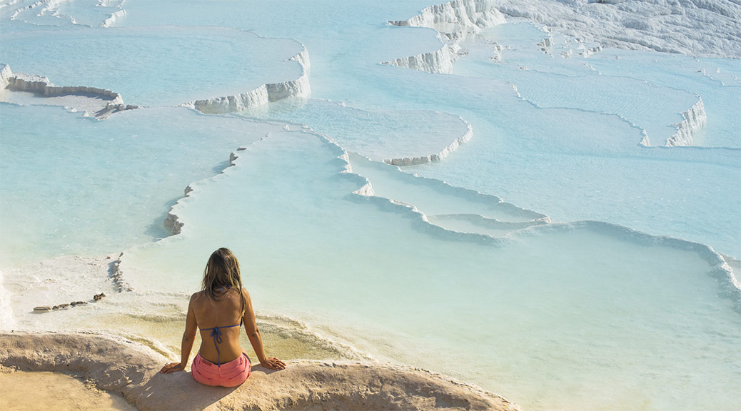 Girl relaxing at hot springs at Pamukkale, Turkey.